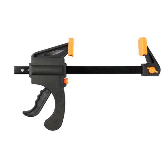 Woodworking bar clamp set securing wood panels during furniture repair — even clamping pressure for glue joints and trim installation