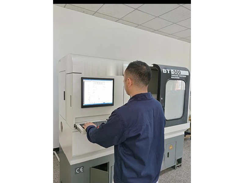 Operator at a torsion-testing machine